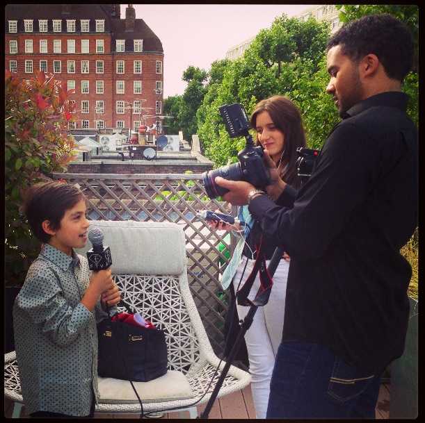 The son of Dr Yannis Alexandrides tries a piece to camera for Fashion TV