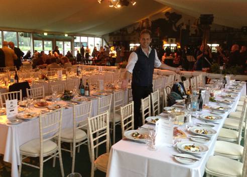 Waiter Ben Nelson, son of former racehorse trainer Charlie Nelson, putting the finishing touches to the EHOA dinner at The Outside Chance, sponsored by Weatherbys Private Banking and Pol Roge