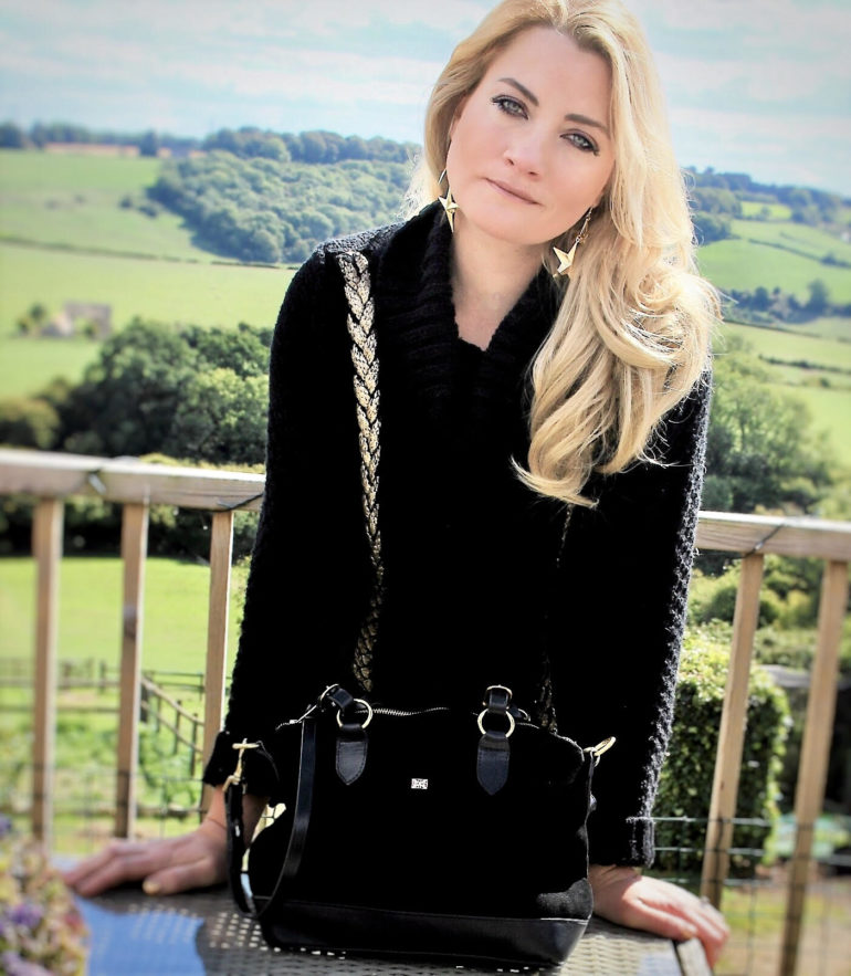 Laura is pictured with the Black Kentucky Bag (RRP £225-£235)